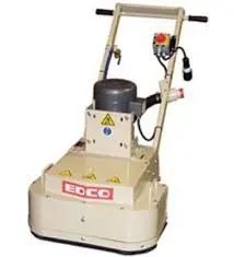 A floor grinder is shown with the handle up.