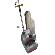 A floor scrubber with a handle and a large attachment.