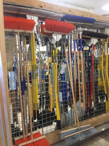 A wall of tools in a store with many different types.