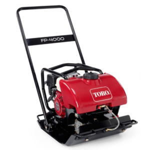 A red and black toro power trowel sitting on top of a metal frame.