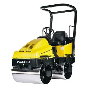 A yellow and black compactor is sitting on the ground