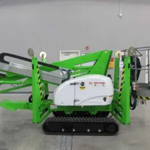 A green and white crane is in the middle of a room.