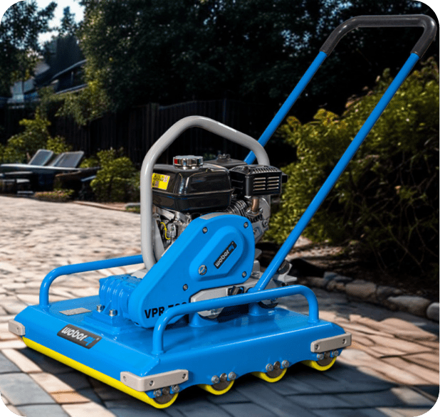 Blue plate compactor on paved driveway